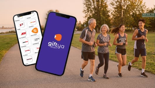 Two phones showing the GiftYa app brand list, beside a family walking outdoors.
