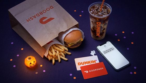 DoorDash and Dunkin e-gifts with a phone, takeout and Halloween treats